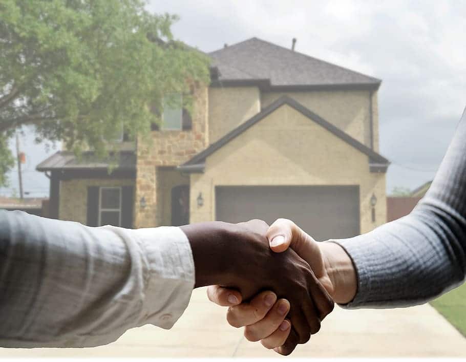 real estate agent shaking hands