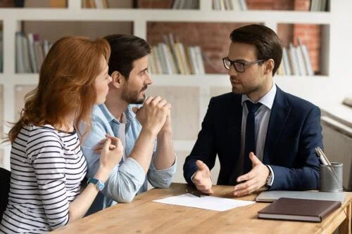 A married couple consults with a lawyer about innocent spouse relief.