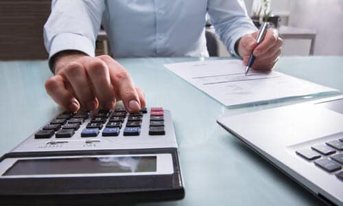 A tax expert working on documents to secure a bank levy release on behalf of a client.