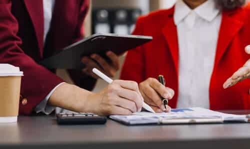 A tax professional helping their client with taxes after the latter received notices from the IRS.