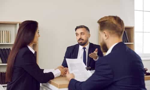 A meeting between a tax professional and a couple where they discuss IRS penalties.