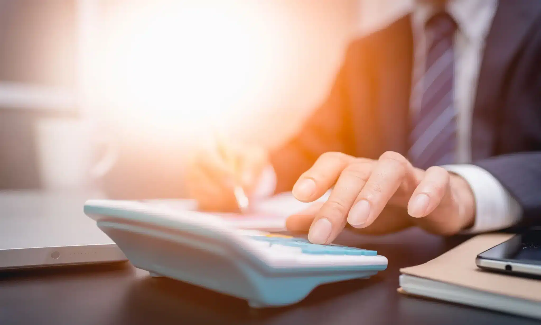 A Montana tax expert calculating how much his client owes and preparing for the arrival of a revenue officer.