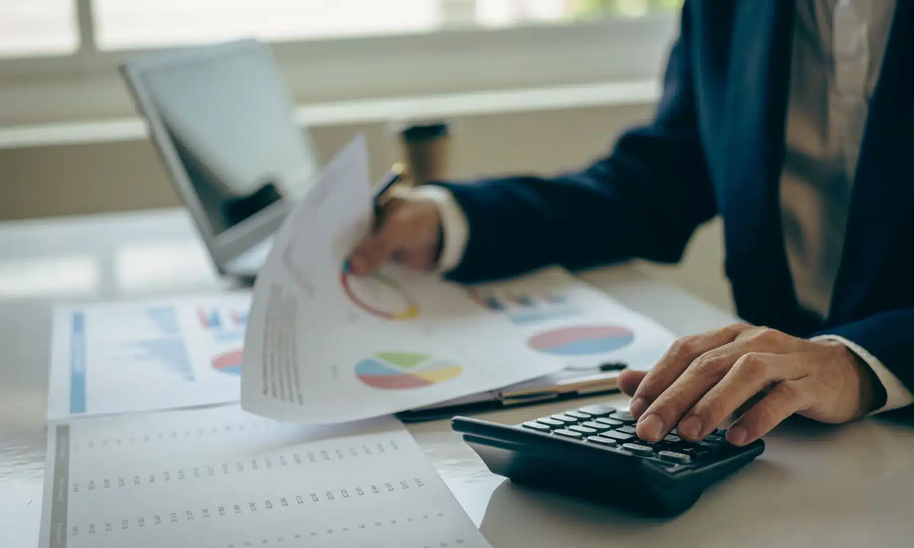 A tax professional taking a look at documents related to a client's income.