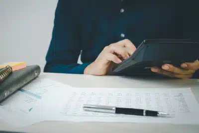 A tax expert preparing a client's records for an IRS revenue officer's visit.