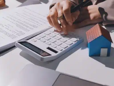 An Englewood tax lawyer studying and calculating the business tax of her client.