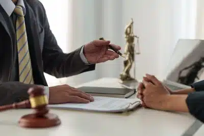 A Bozeman tax lawyer speaks with a client about federal and state tax lien removal as they both sit inside a law office